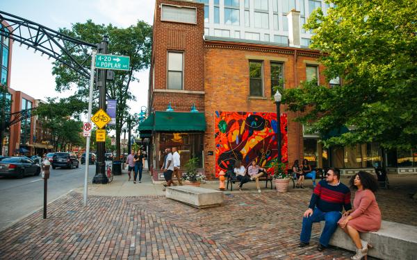 Cobble stone street with mural painted on building wall